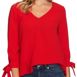 Bright red CeCe long sleeve V-neck tie-cuff blouse